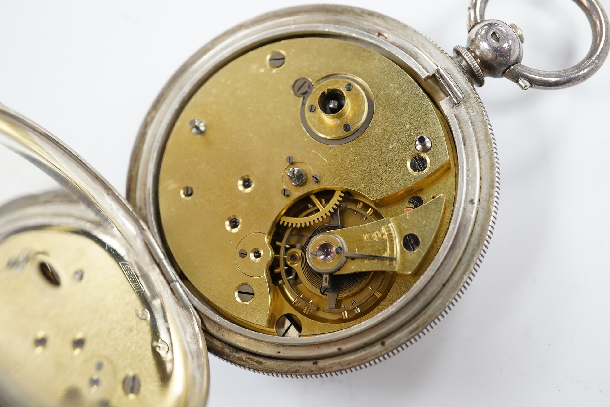 A late 19th century engine turned Swiss 935 standard white metal key wind open faced pocket watch, with engraved inscription relating to J.B. Dent & Sons, London, case diameter 53mm. Condition - fair